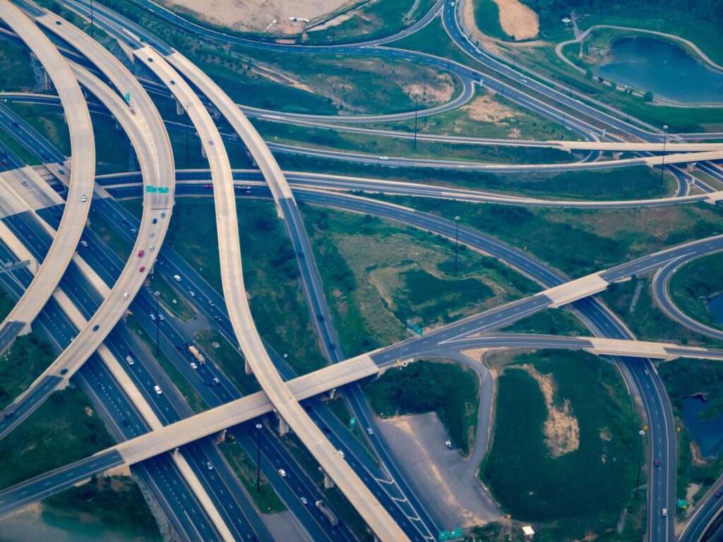 Aerial view of a motorway interchange threading through open land